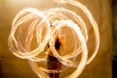 Close-up of fire spinning dancer