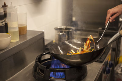 Person preparing food in kitchen at home