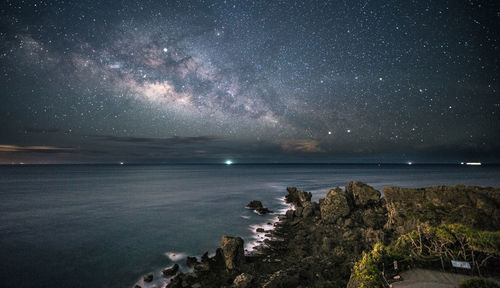 Scenic view of sea against sky at night