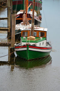 Boats moored in lake