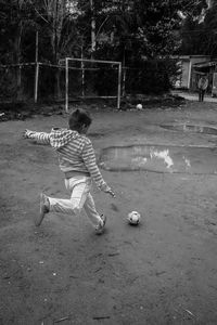Boy playing on ground