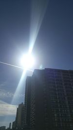 Low angle view of bright sun