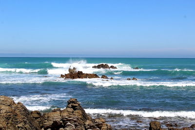 Scenic view of sea against clear sky