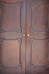 Full frame shot of closed wooden door of building