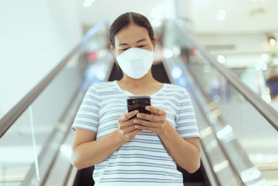 Young woman using mobile phone