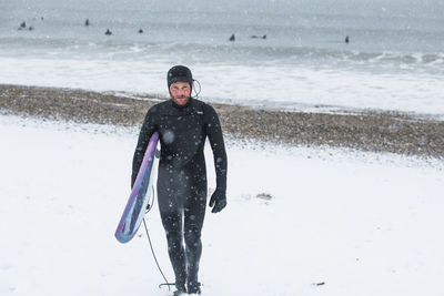 Man surfing during winter snow