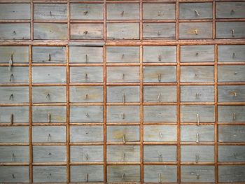 Full frame of wooden drawers