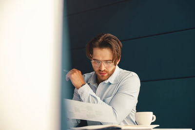 Portrait of young man using mobile phone