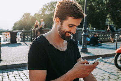 Young man using mobile phone