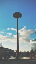 Low angle view of building against cloudy sky
