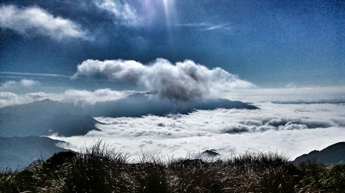 View of calm sea against cloudy sky