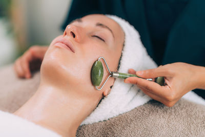 Woman lying for beauty treatment at spa