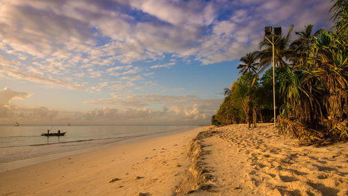 Scenic view of beach against sky during sunset