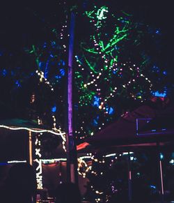 Low angle view of illuminated lights at night