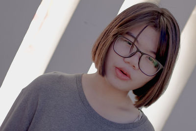 Close-up portrait of a serious young woman