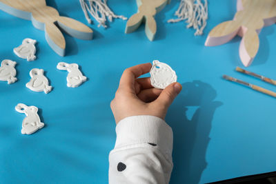 High angle view of boy playing jigsaw puzzle