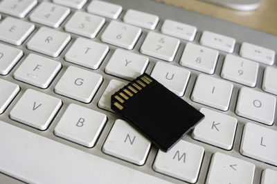 Close-up of memory card on computer keyboard