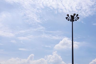 Low angle view of floodlight against sky