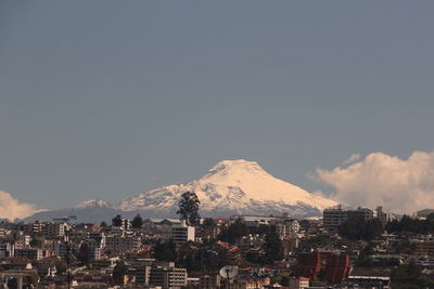 View of cityscape against mountain range