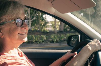 Senior woman driving car