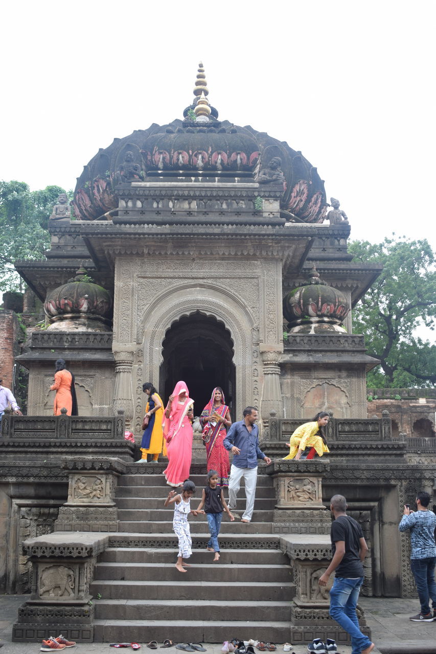 GROUP OF PEOPLE IN TEMPLE