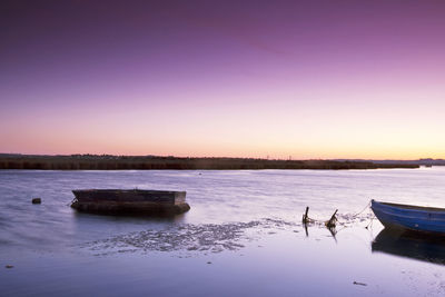 Scenic view of sea against clear sky during sunset