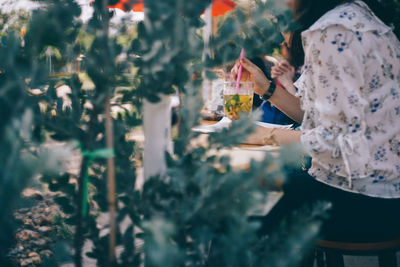 Close-up of woman drinking water