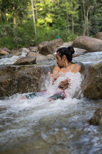 Water flowing through rocks in river