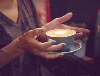 Man holding coffee cup