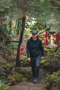 Adventurer walks through the monte palace madeira botanical garden in funchal, of portuguese island