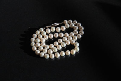 High angle view of eggs in container against black background