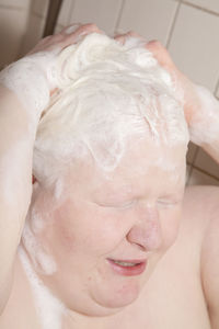 Close-up of baby boy in bathroom