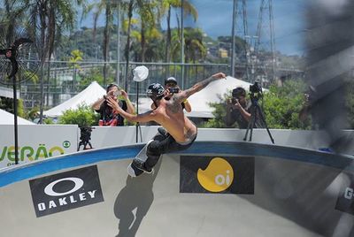 Person holding camera while standing on table