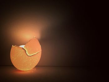 Glowing broken eggshell against wall