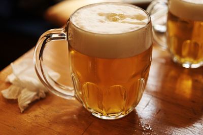 Close-up of beer glass on table