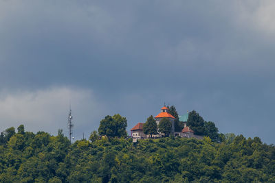 View of trees and buildings against sky