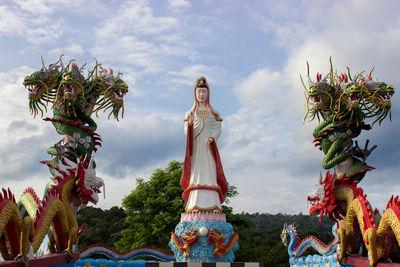 Low angle view of statue against sky