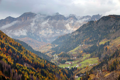 High angle view of valley and mountains against sky