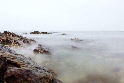 Scenic view of sea against clear sky