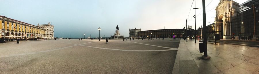 Panoramic view of city street against sky