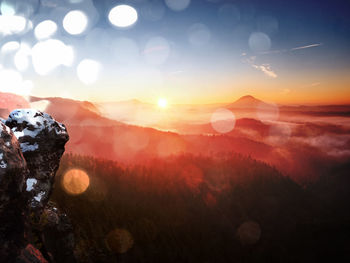 Scenic view of mountains against sky during sunset