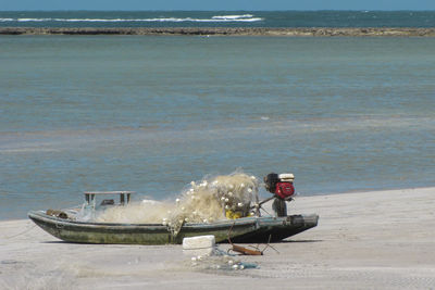 Fishing equipment in boat at sea shore