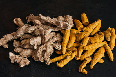 High angle view of fresh vegetables on table against black background