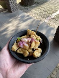 High angle view of hand holding food