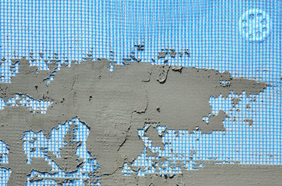 Close-up of text on wall by swimming pool