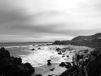 Scenic view of sea against cloudy sky