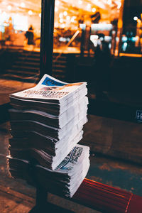 Stack of newspapers on bench