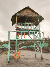 People on beach against sky
