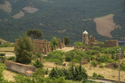 View of landscape with mountain range in background
