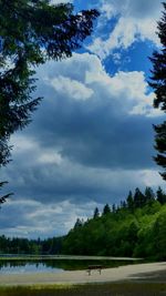 Scenic view of landscape against cloudy sky